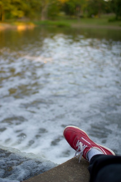 red shoe by the lake