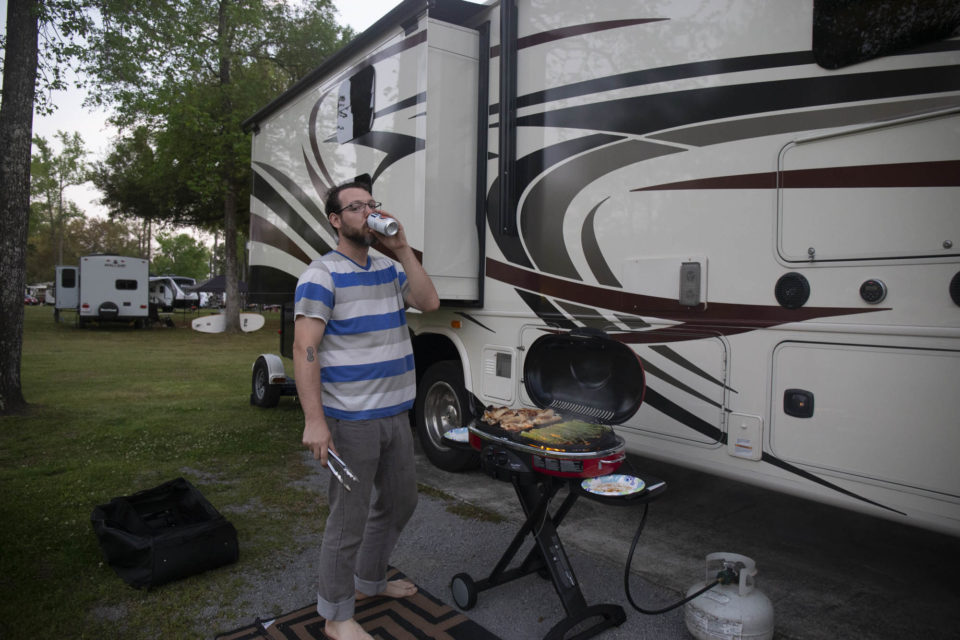 Deven drinking beer and RVing