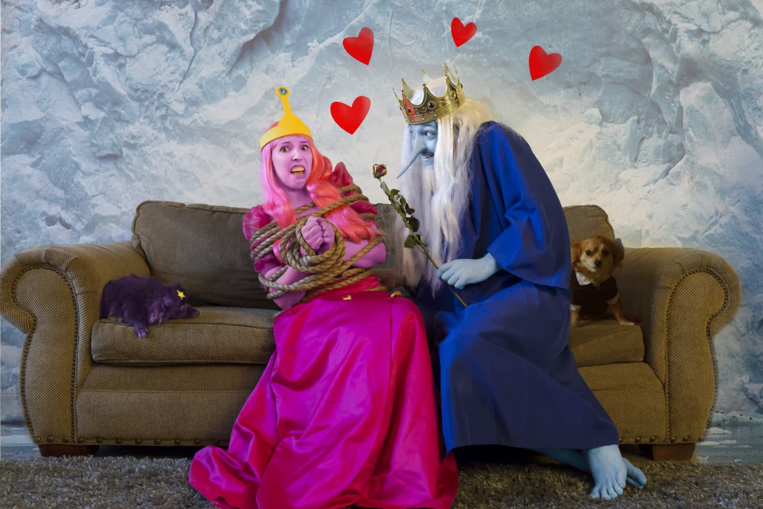 Lauren and Deven in a February couch scene inspired by Adventure Time and Valentine's Day.