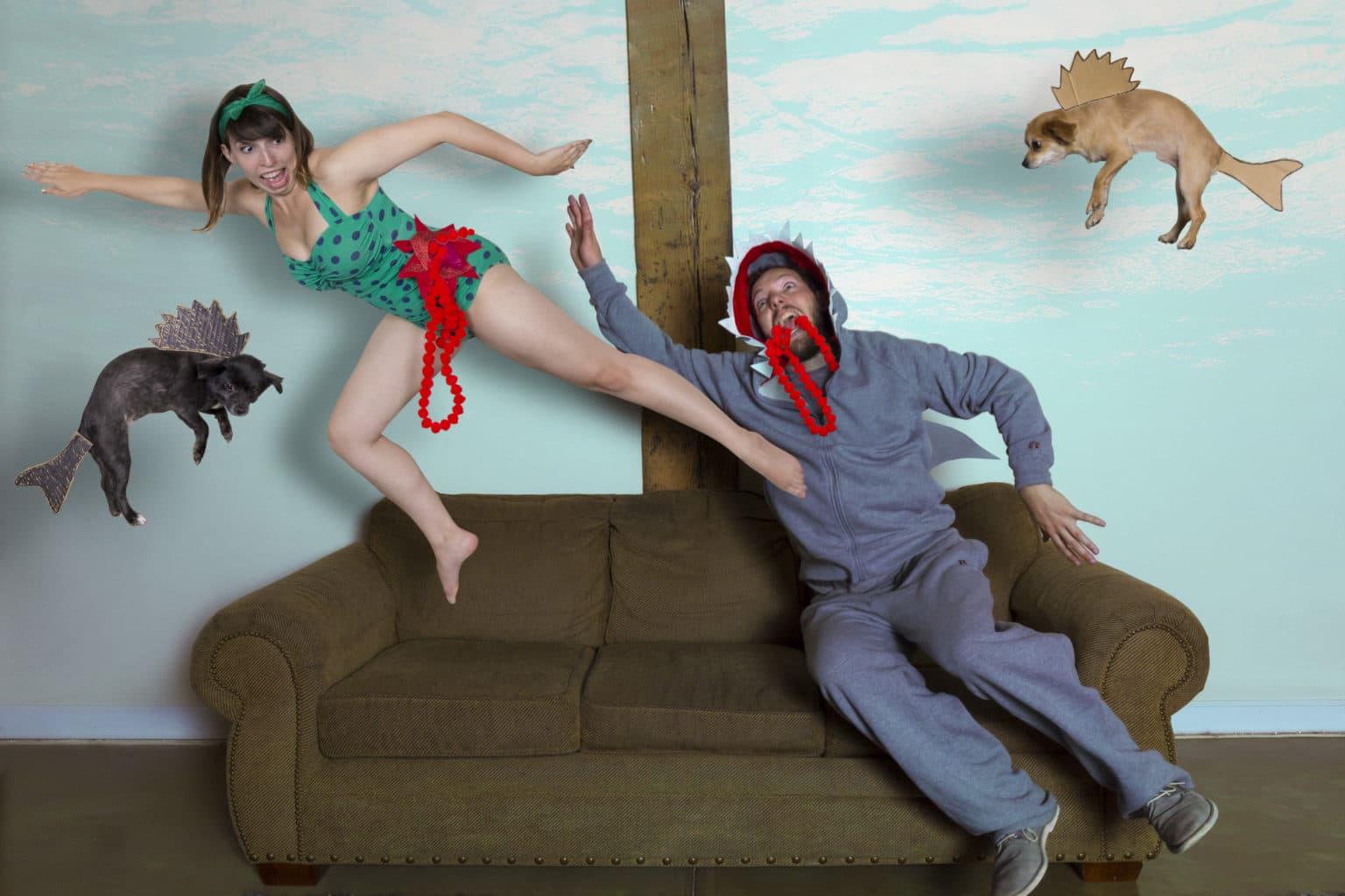 Lauren and Deven in a shark-themed couch scene.
