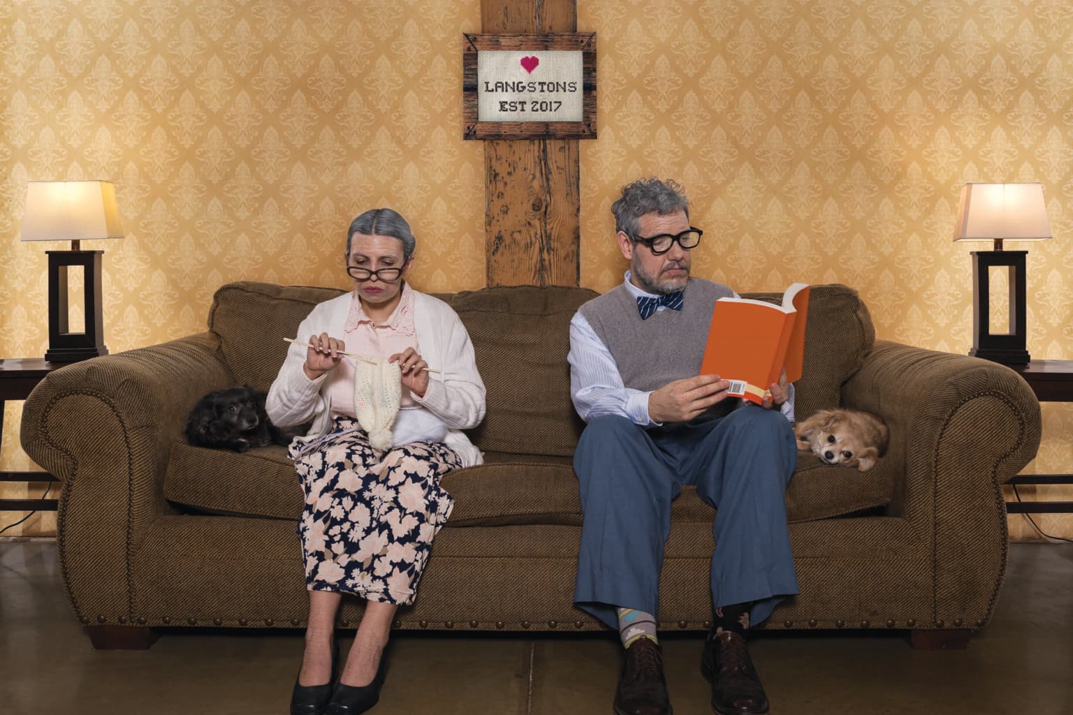Lauren and Deven styled as an older couple on the couch.