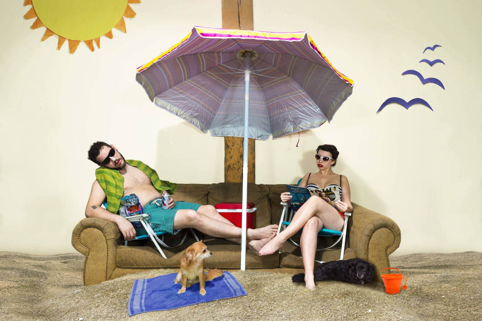 Lauren and Deven with the couch in a beach scene.