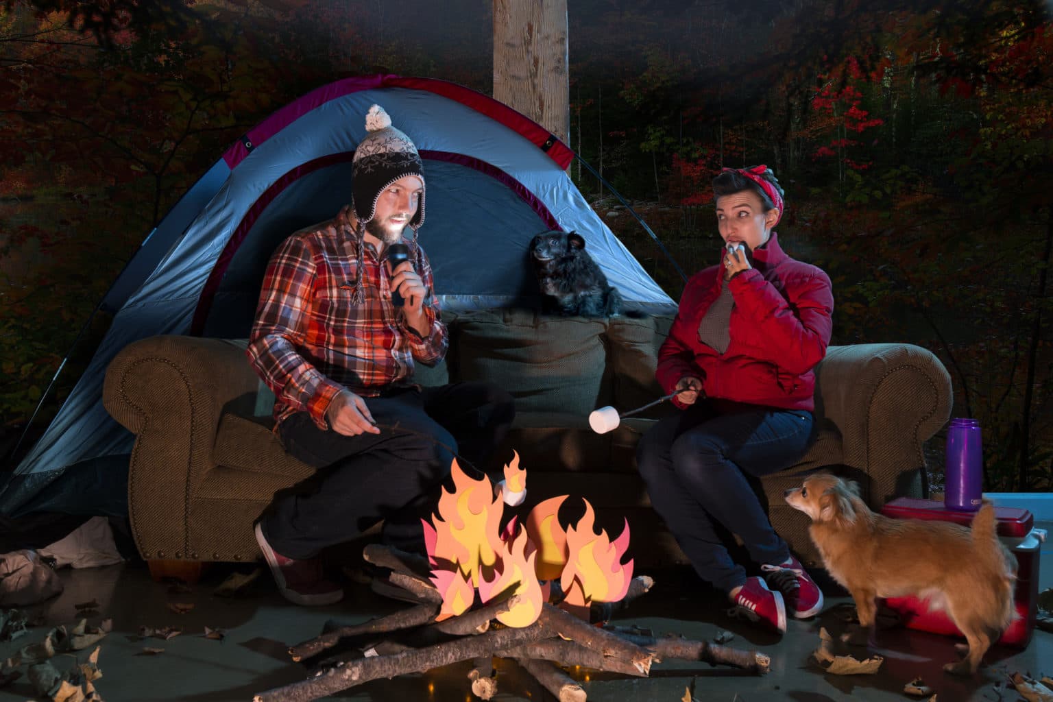 Lauren and Deven telling stories beside a campfire and the couch.