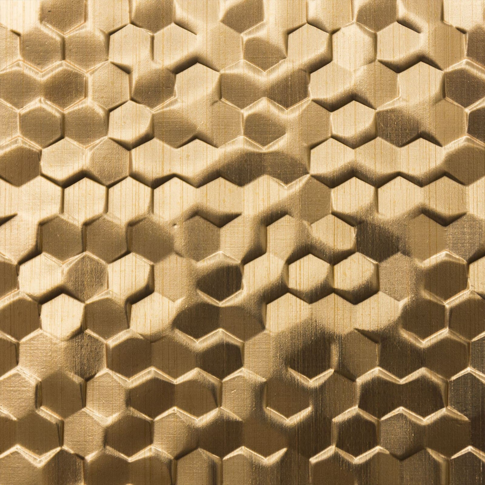 Gold-toned diamond-plate metal pattern.
