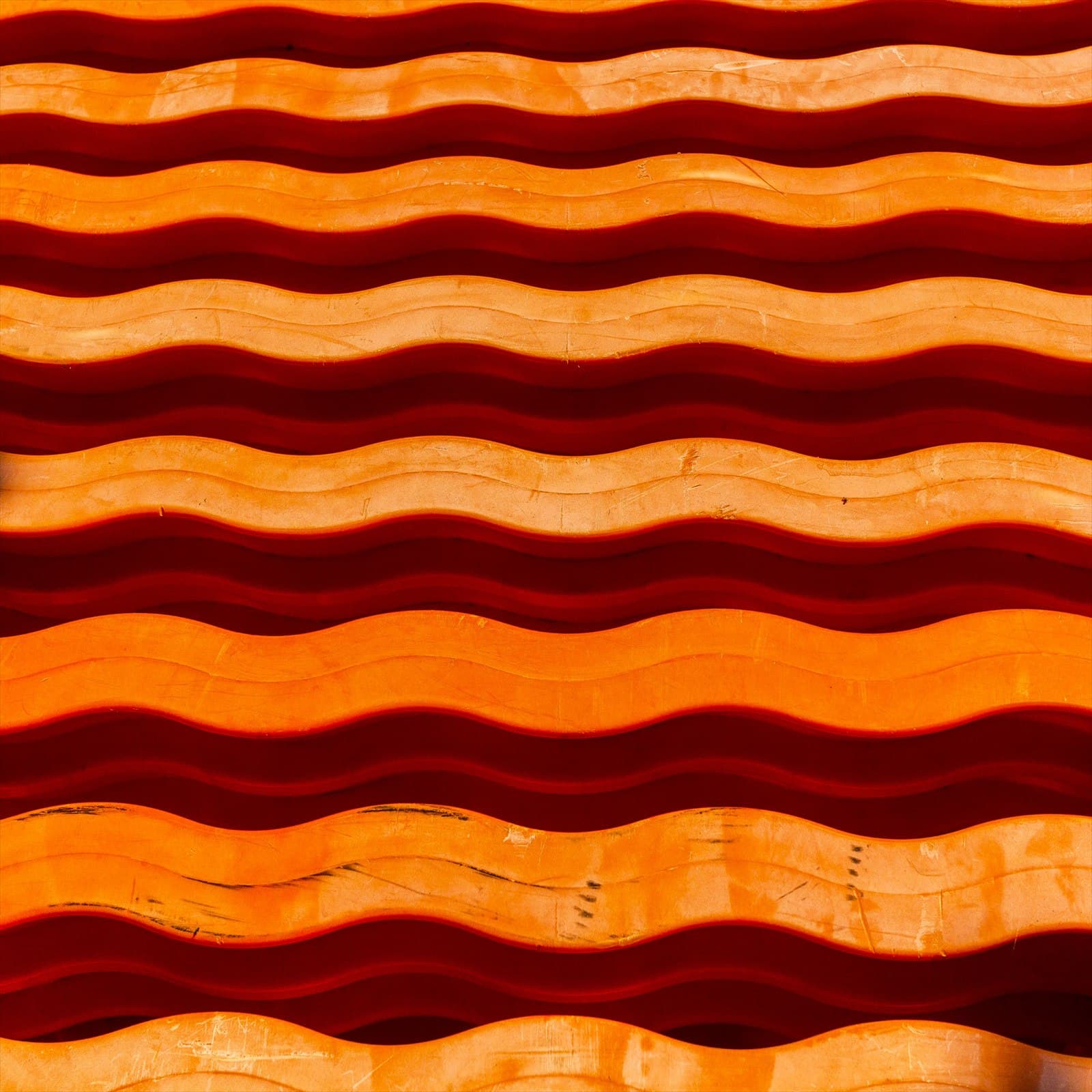 Orange wave-like repeating pattern.