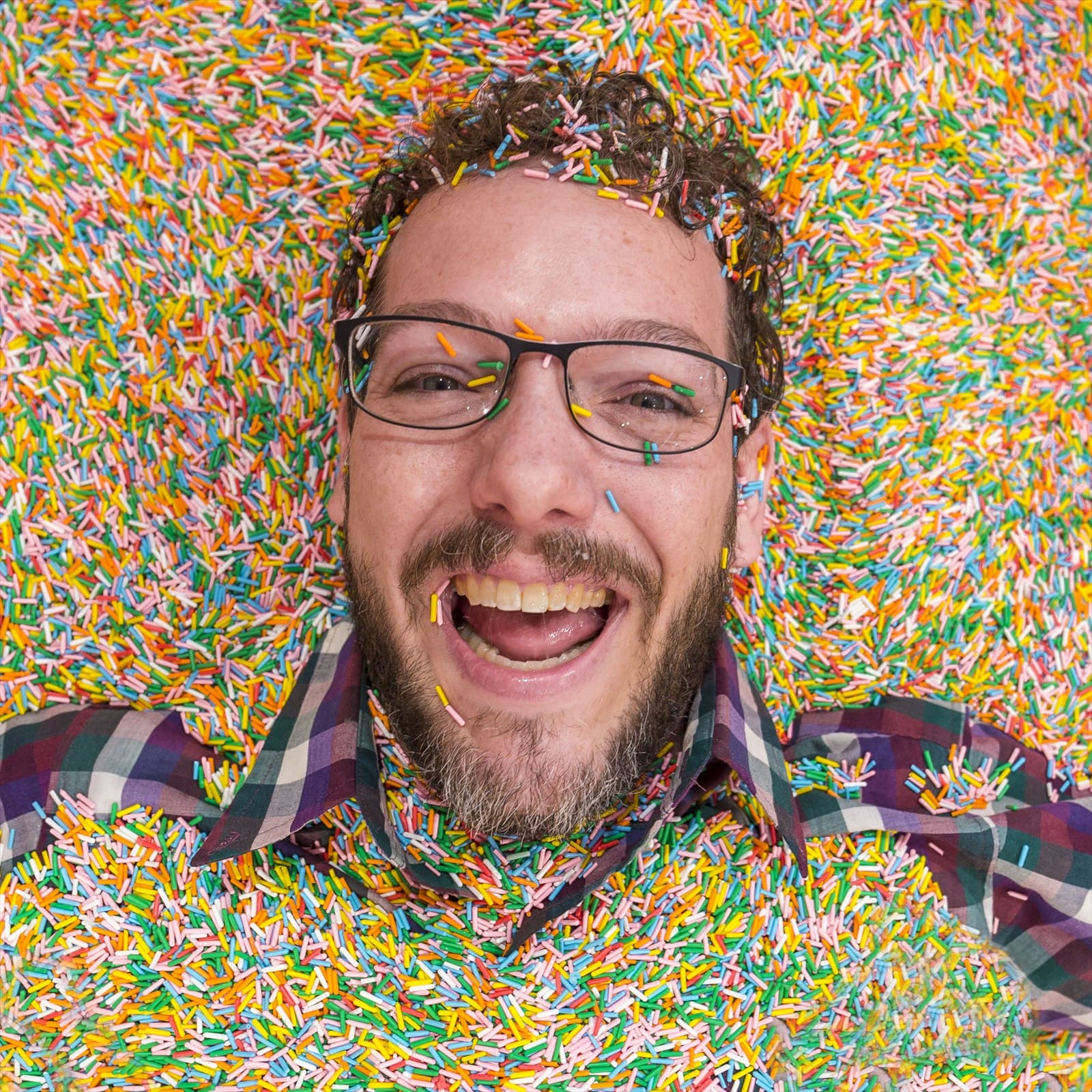 Colorful sprinkles forming a dense pattern.