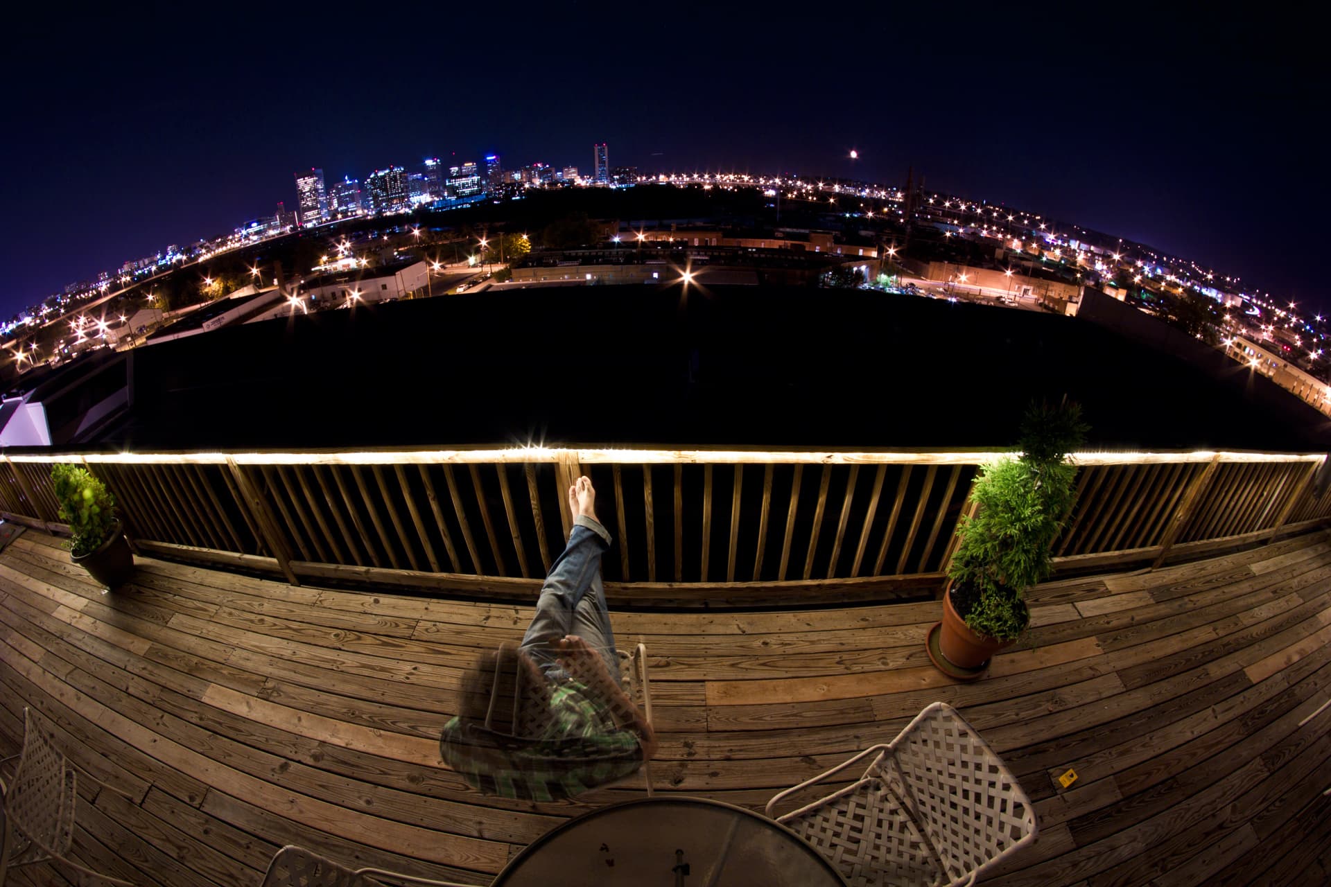 City seen through a circular foreground form.