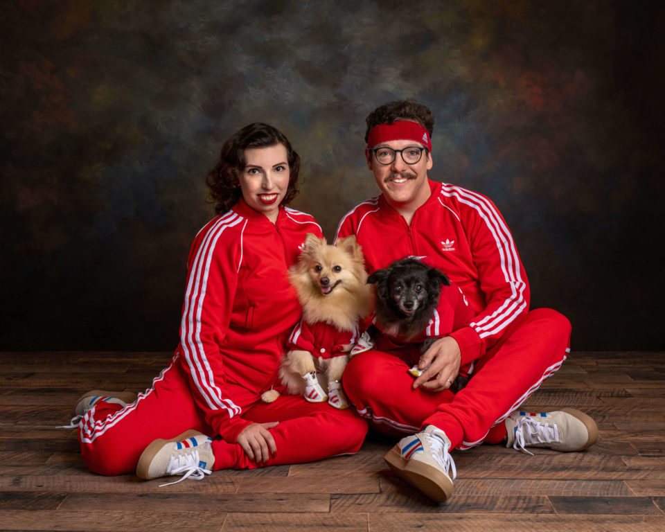 deven and lauren langston with dogs in track suits